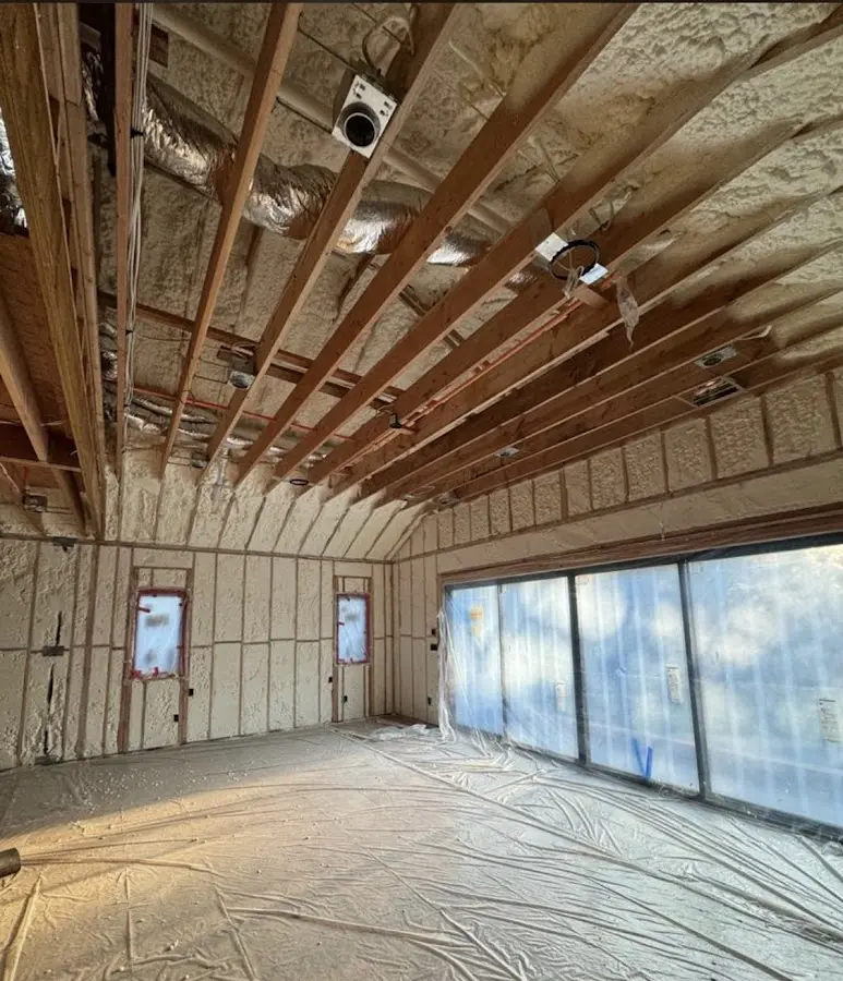 Interior walls and ceiling insulated with spray foam during new construction in Louisburg