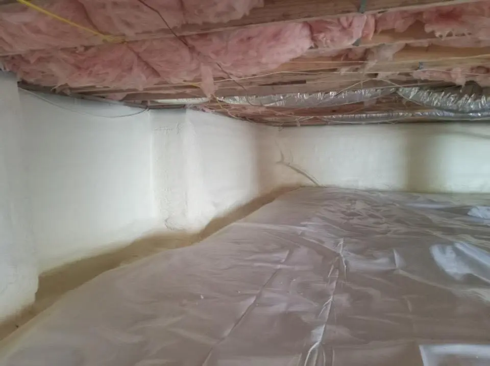 Crawl space encapsulation with closed-cell spray foam for Commercial Roof Restoration in Louisburg